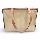 Loewe Cushion Tote handbag in canvas with leather trim, showcasing a stylish beige design perfect for everyday use.