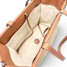 Inside view of Loewe Cushion Tote handbag featuring canvas with leather trim.