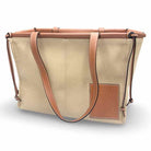 Loewe Cushion Tote handbag featuring a canvas body with leather trim, ideal for stylish everyday use.